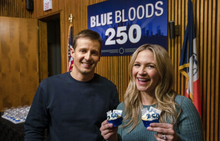 Will Estes and Vanessa Ray on Blue Bloods set with cupcakes