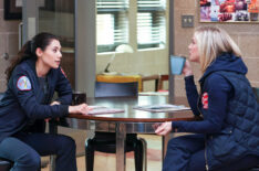 Hanako Greensmith as Violet and Kara Killmer as Sylvie Brett drinking coffee in Chicago Fire - Season 10