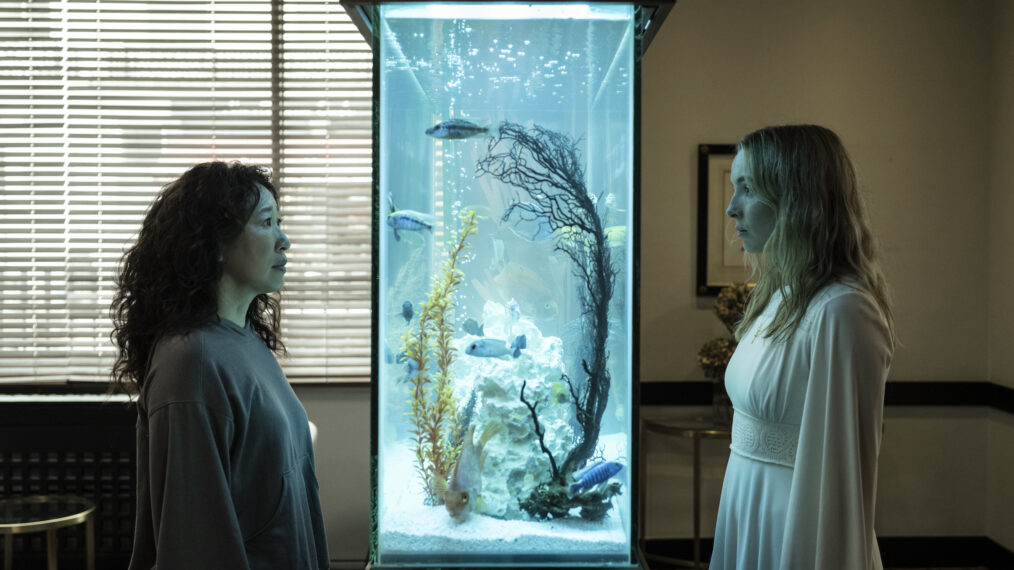 Sandra Oh as Eve Polastri and Jodie Comer as Villanelle with a fish tank between them in Killing Eve