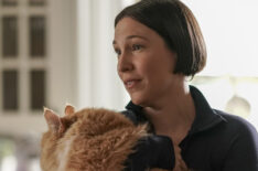 Rebecca Henderson as Olivia holding a big cat in Single Drunk Female