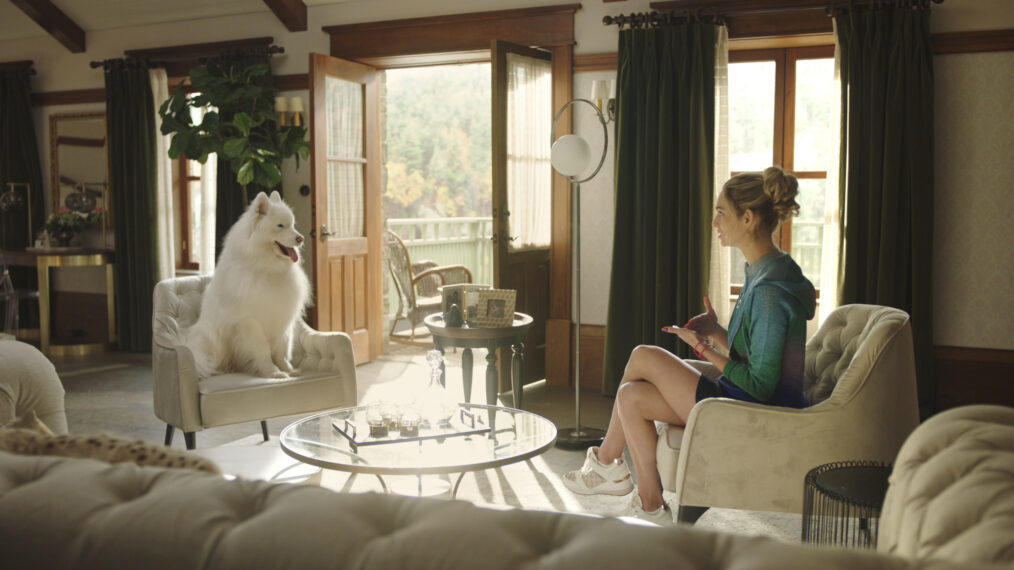 Allegra Edwards as Ingrid talking to a dog in Upload