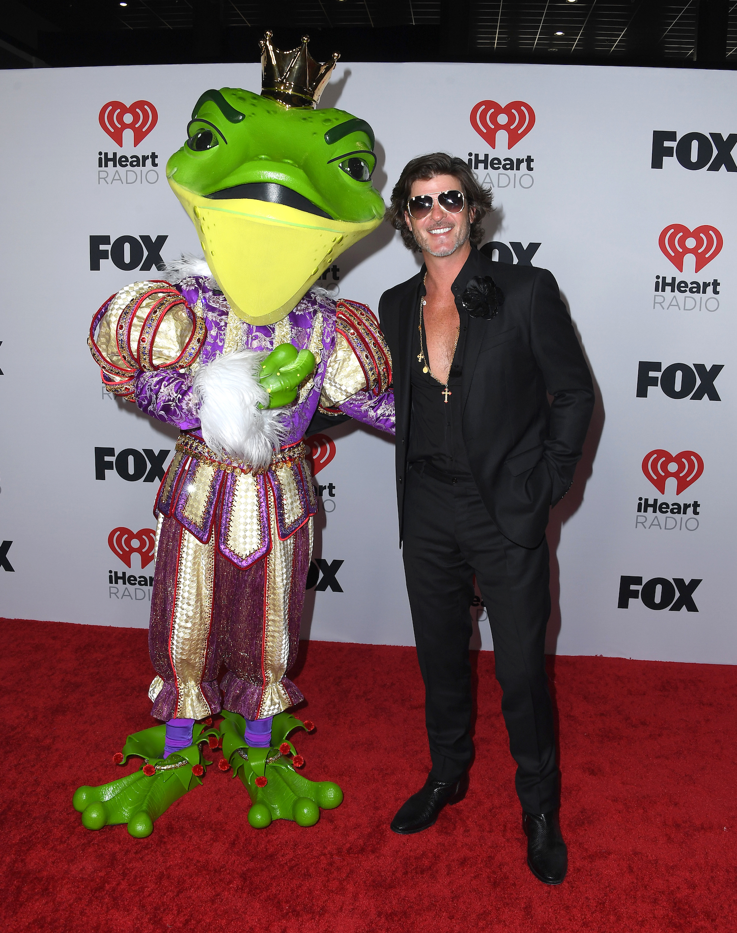 Robin Thicke and a masked singer attend the 2022 iHeartRadio Music Awards