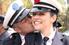 Taylor Kinney as Kelly Severide kissing Miranda Rae Mayo as Stella Kidd on the cheek in Chicago Fire