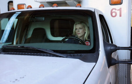 Kara Killmer as Sylvie Brett sitting in an ambulance in Chicago Fire - Season 10