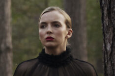 Jodie Comer in a black dress in the forest as Villanelle in Killing Eve