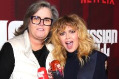 Rosie O'Donnell and Natasha Lyonne and holding Russian Dolls