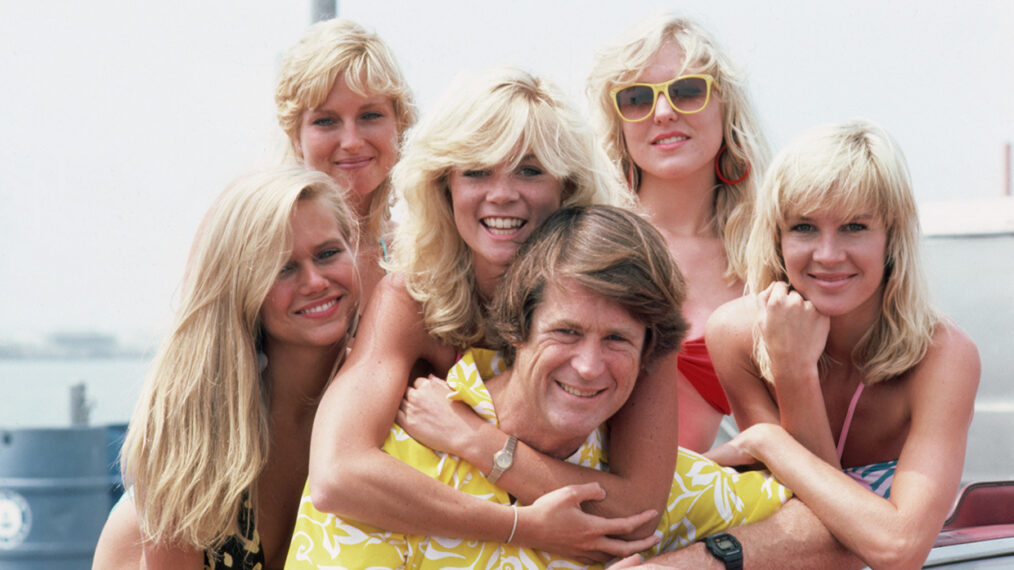 Brian Wilson of the Beach Boys poses with a group of blonde women