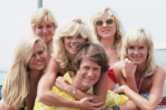 Brian Wilson of the Beach Boys poses with a group of blonde women