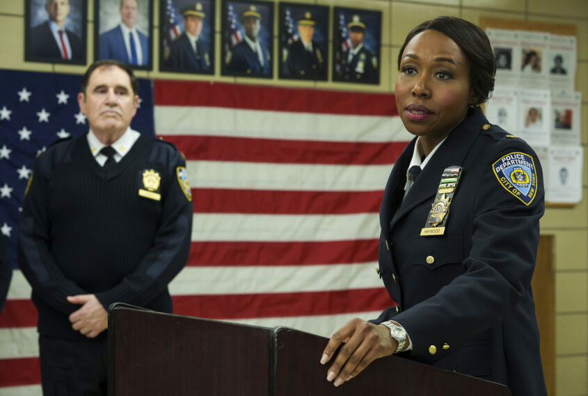 Richard Kind as Captain Stan Yenko and Amanda Warren as Regina Haywood in East New York