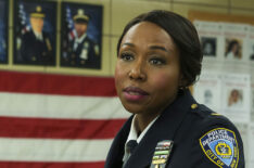 Richard Kind as Captain Stan Yenko and Amanda Warren as Regina Haywood in East New York