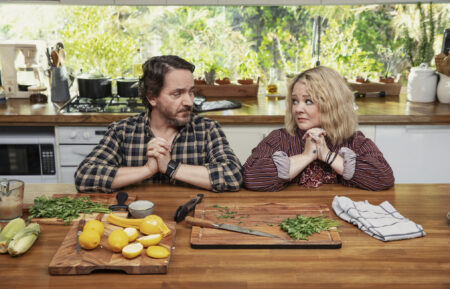 Ben Falcone as Clark Thompson, Melissa McCarthy as Amily Luck in God's Favorite Idiot