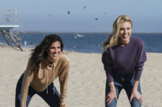 Daniela Ruah as Kensi and Bar Paly as Anna playing cornhole on the beach in NCIS Los Angeles