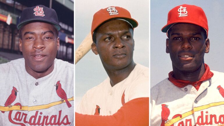 (L-R) St. Louis Cardinals players Bill White, Curt Flood, and Bob Gibson