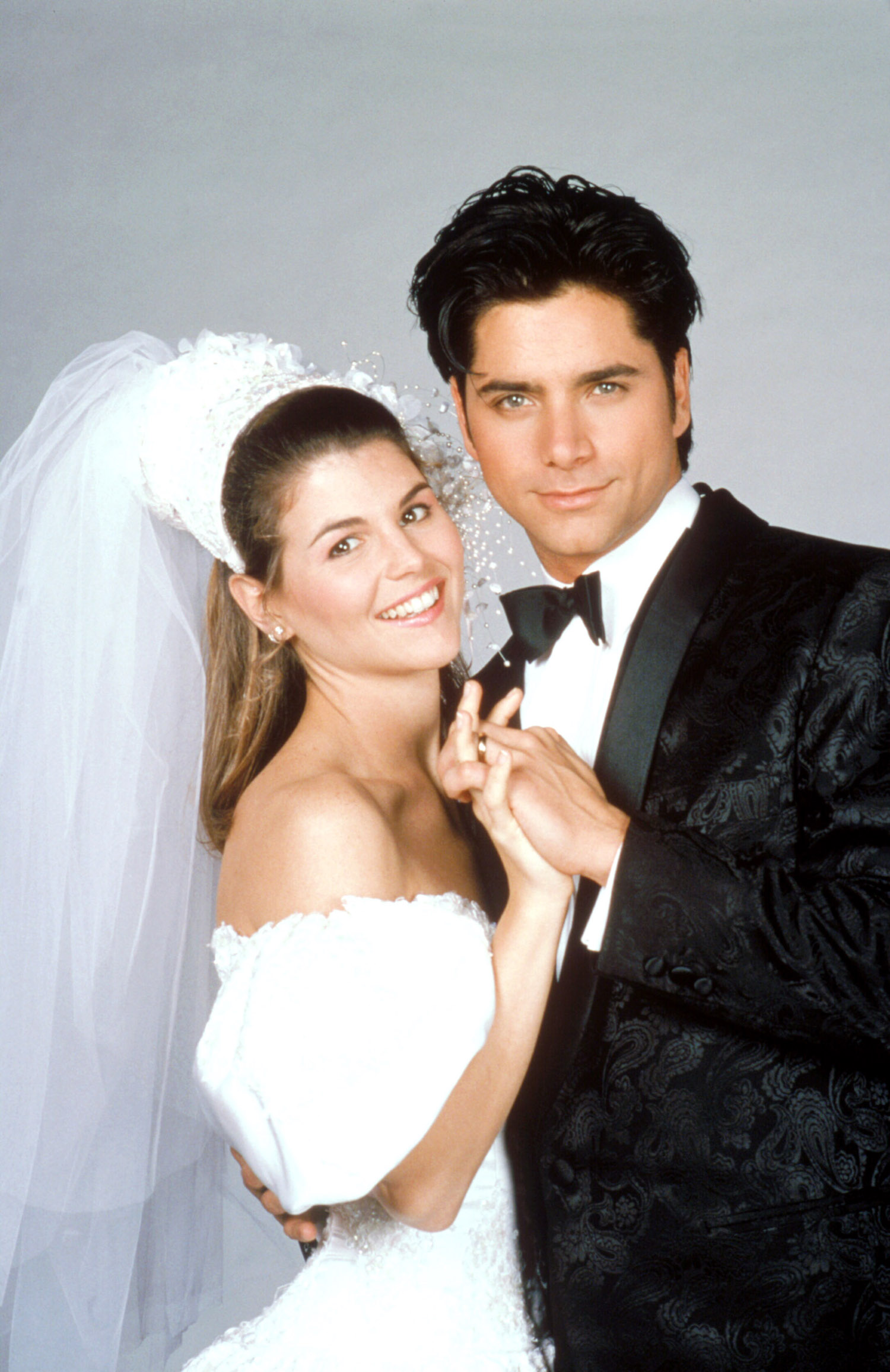 Lori Loughlin as Becky and John Stamos as Jesse get married in Full House