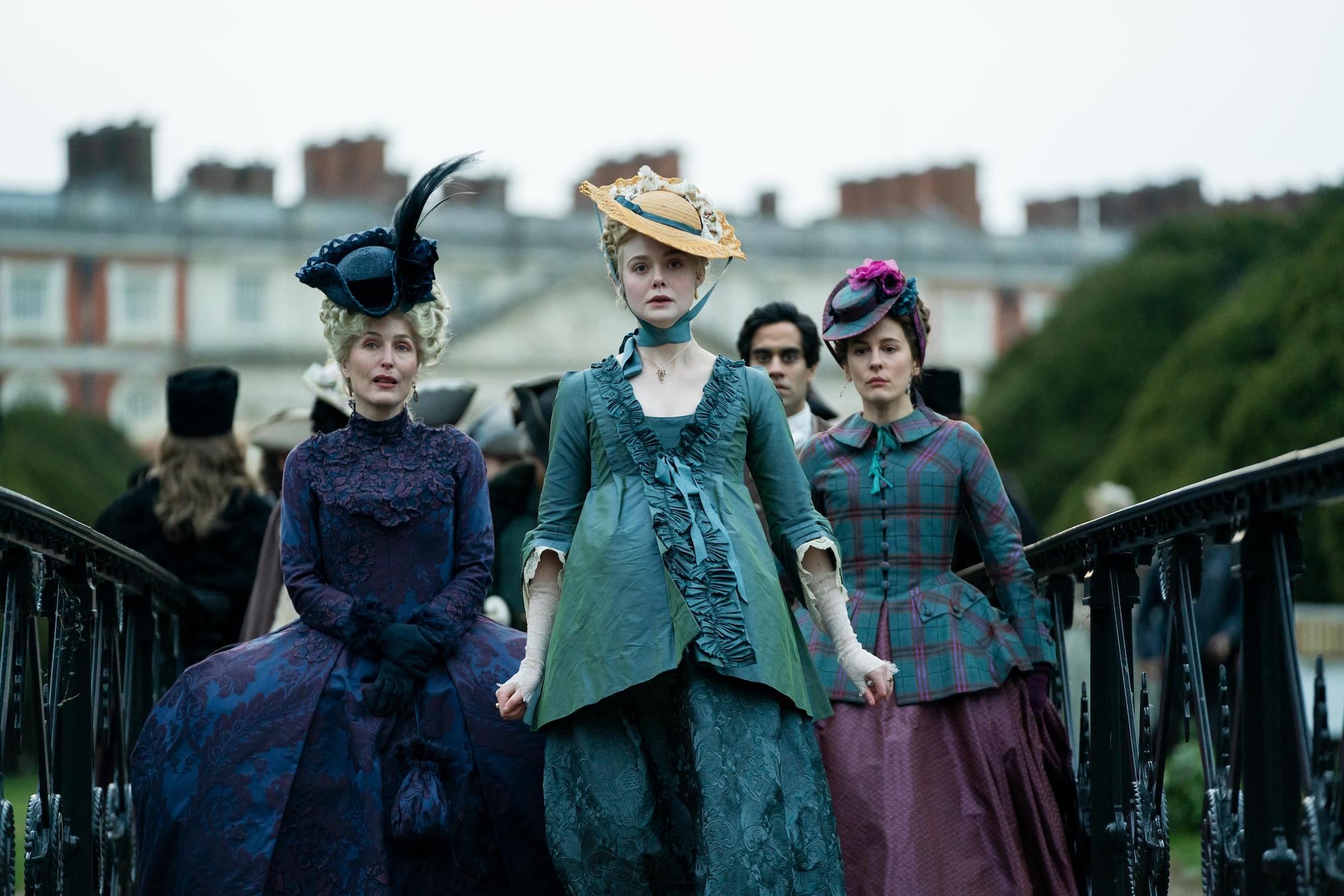 Gillian Anderson, Elle Fanning, and Phoebe Fox Phoebe Fox as Marial and Elle Fanning as Catherine in 'The Great' Season 2 on Hulu