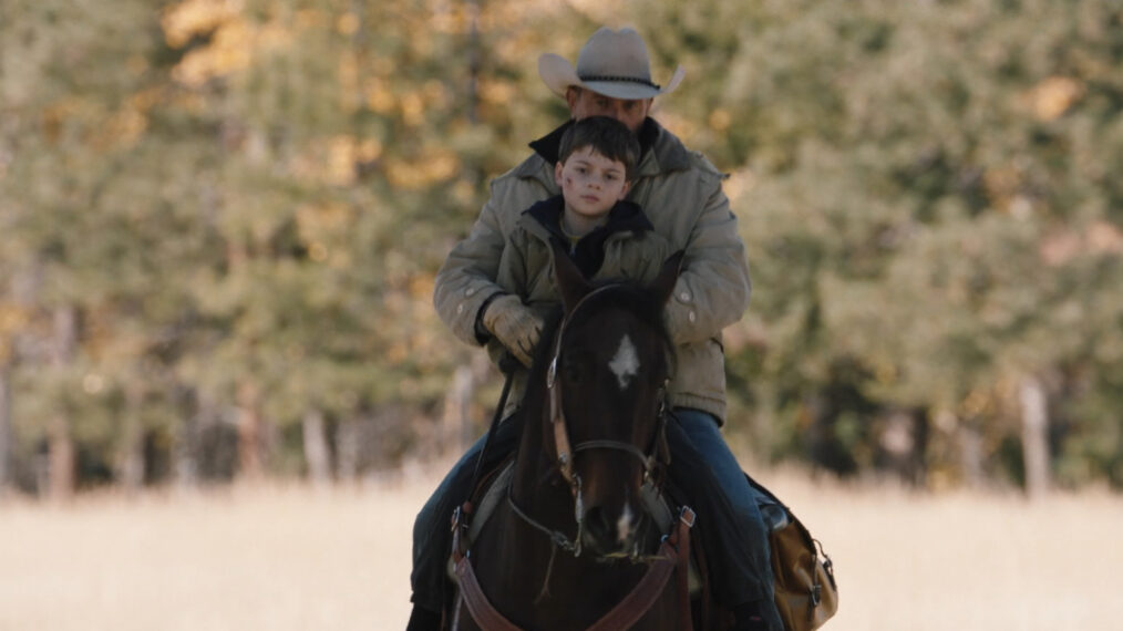 Kevin Costner as John Dutton on a horse with Brecken Merrill as Tate Dutton in Yellowstone