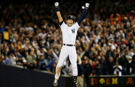 Derek Jeter #2 of the New York Yankees celebrates after a game winning RBI hit in the ninth inning against the Baltimore Orioles in his last game ever at Yankee Stadium on September 25, 2014 in the Bronx borough of New York City