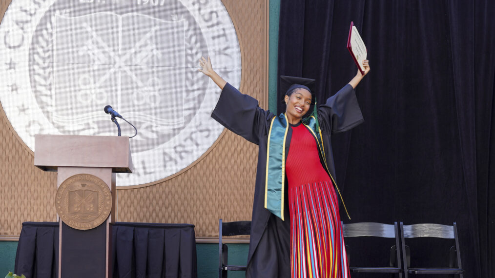 Yara Shahidi as Zoey Johnson in grown-ish receiving her diploma