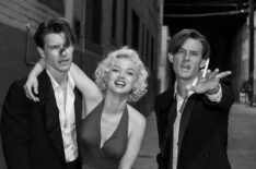 Blonde - Xavier Samuel as Cass Chaplin, Ana de Armas as Marilyn Monroe, and Evan Williams as Eddy G. Robinson Jr.