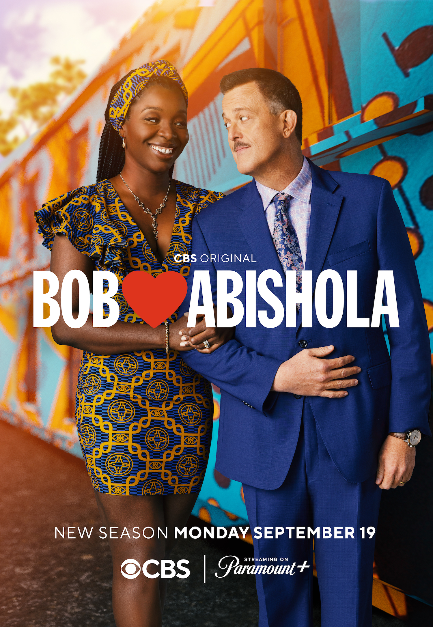 Billy Gardell and Folake Olowofoyeku in Bob Hearts Abishola Season 4 key art