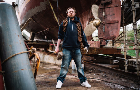Jake Anderson standing with chains and hammer in Deadliest Catch: The Viking Returns