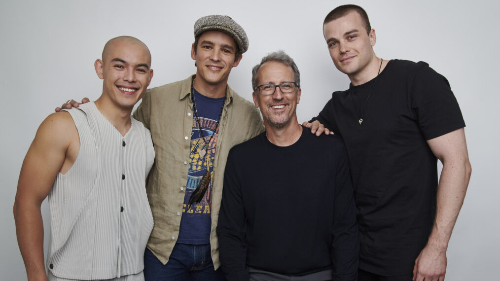 Ryan Potter, Brenton Thwaites, and Joshua Orpin pose with executive producer Greg Walker for a group 'Titans' team portrait at New York Comic Con 2022