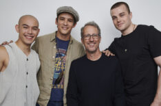 Ryan Potter, Brenton Thwaites, and Joshua Orpin pose with executive producer Greg Walker for a group 'Titans' team portrait at New York Comic Con 2022