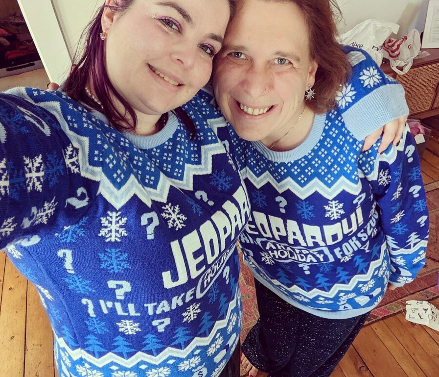 Amy and her wife Genevieve celebrate the holidays in cute matching sweaters.