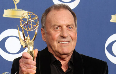 Bruce Gowers poses in the press room with his Emmy