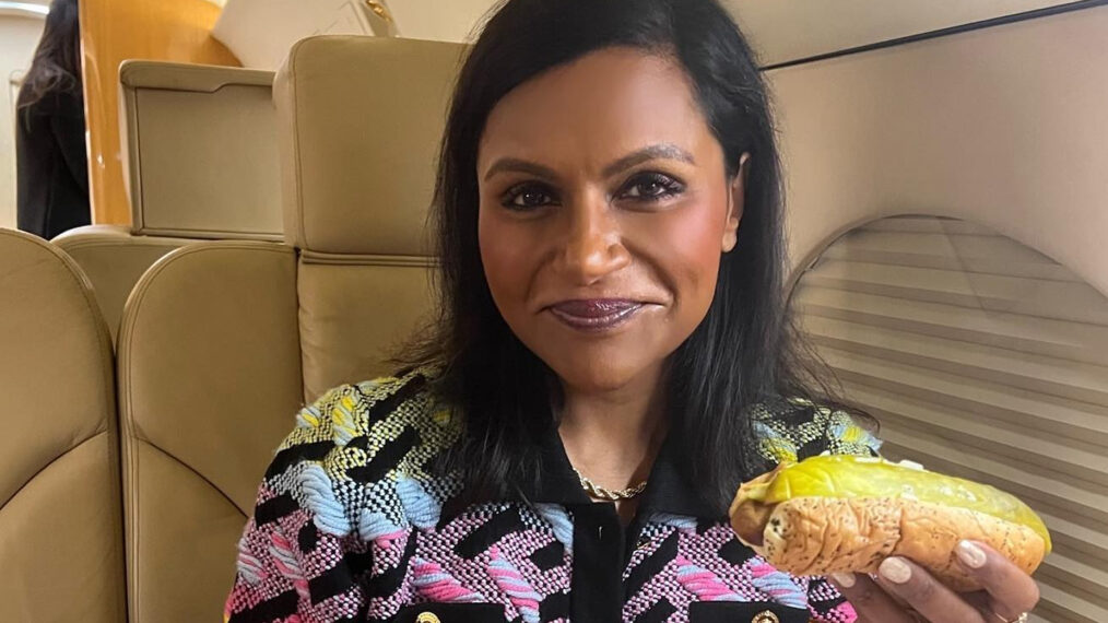 Mindy Kaling eats a hotdog