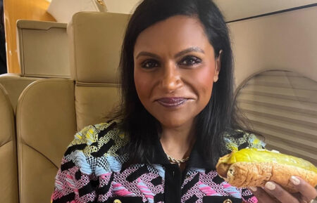 Mindy Kaling eats a hotdog