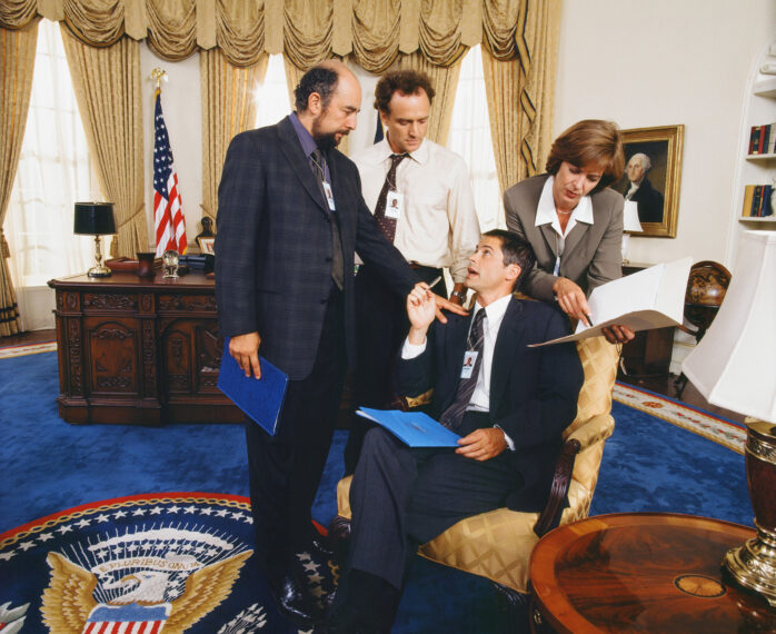 Richard Schiff, Bradley Whitford, Rob Lowe, and Allison Janney in The West Wing