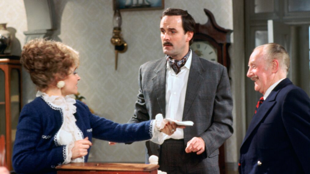 Prunella Scales, John Cleese, and Ballard Berkley in 'Fawlty Towers'