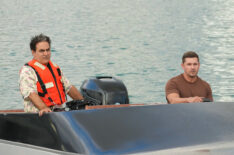 Jason Antoon and Linc Hand on a boat in 'NCIS: Hawai'i'