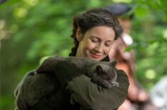 Caitriona Balfe with a cat behind the scenes of 'Outlander' Season 7