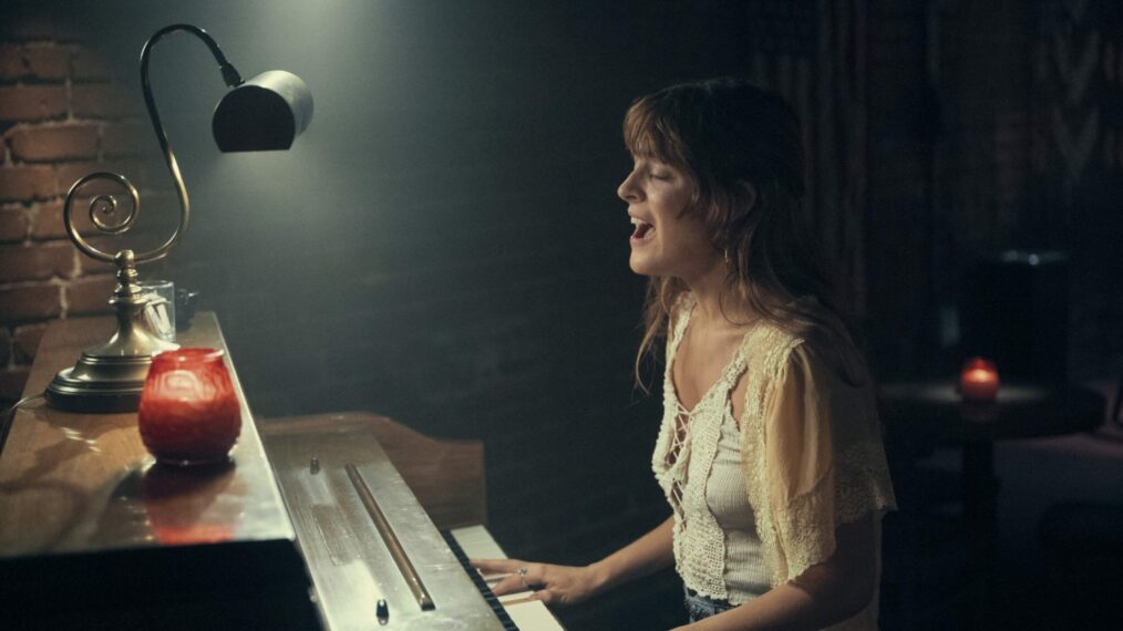 Riley Keough playing piano