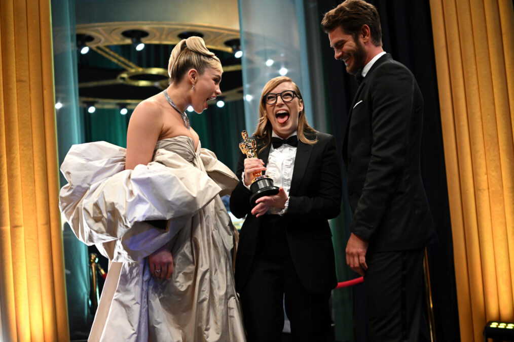 Florence Pugh and Andrew Garfield backstage with Best Adapted Screenplay winner Sarah Polley at the 2023 Oscars
