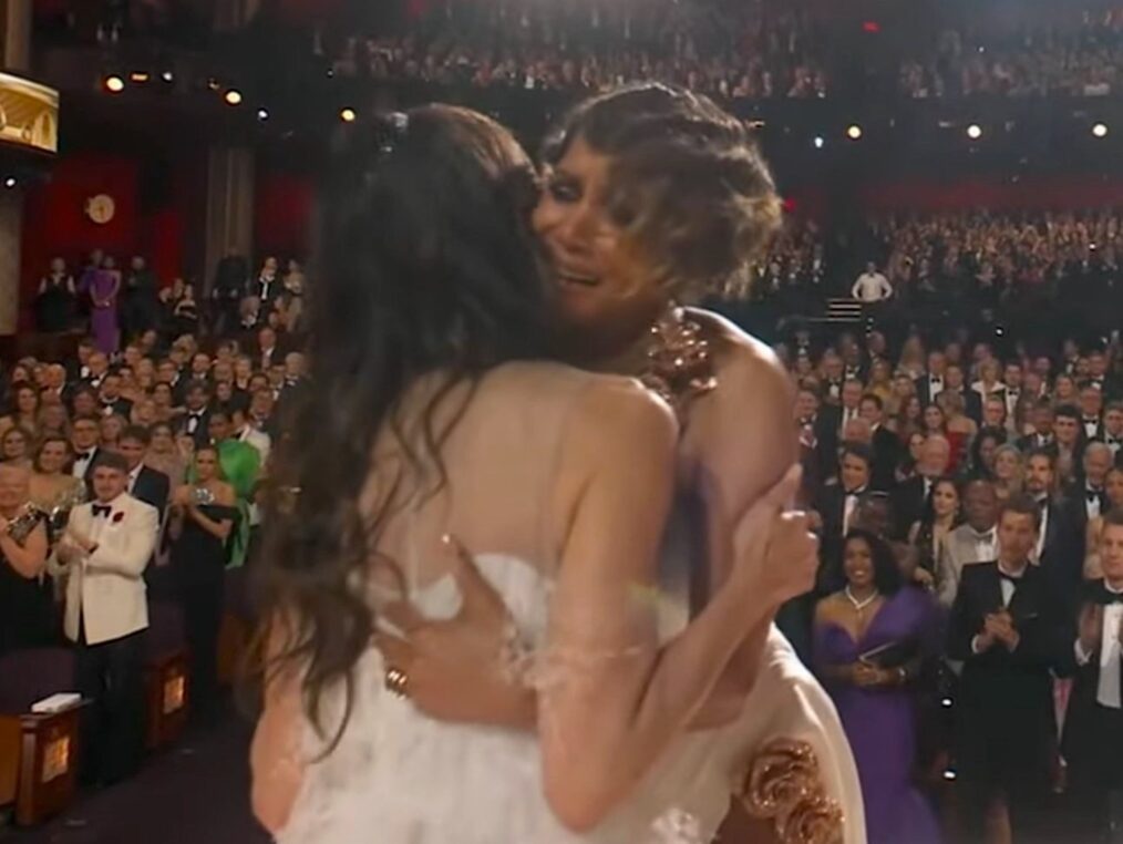 Halle Berry and Michelle Yeoh embrace as Yeoh accepts the award for Best Actress at the 2023 Oscars