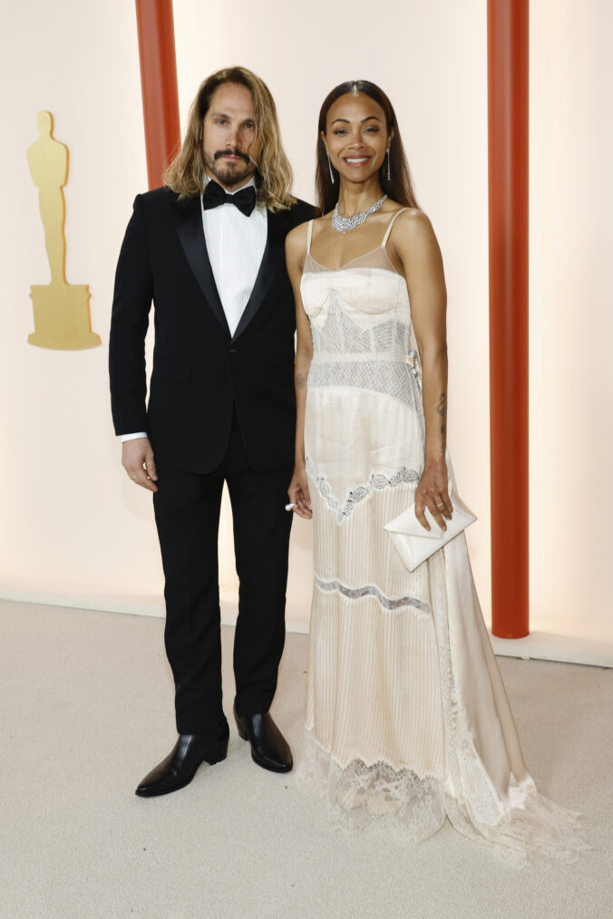 Marco Perego and Zoe Saldana arrive at the 2023 Oscars