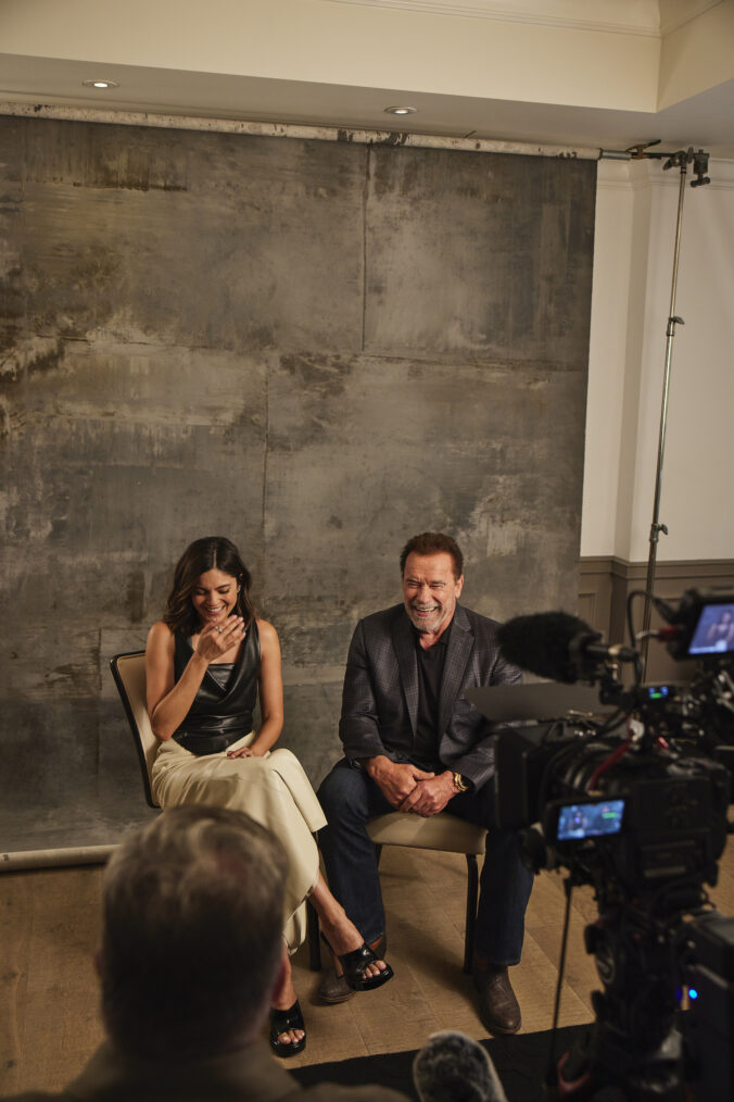 Monica Barbaro and Arnold Schwarzenegger behind the scenes of 'FUBAR' shoot