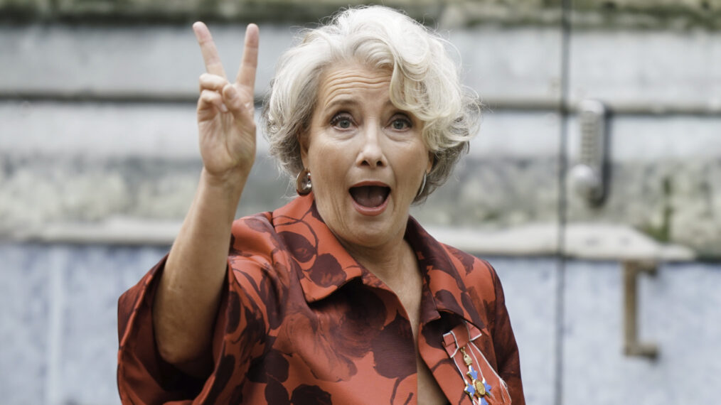 Emma Thompson flashing the peace sign outside Westminster Abbey at the crowning of King Charles