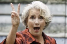 Emma Thompson flashing the peace sign outside Westminster Abbey at the crowning of King Charles