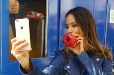 Jamie Chung eats a donut to celebrate the launch of Apple Pay in 2014