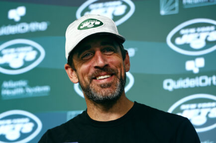 Aaron Rodgers of the New York Jets talks to reporters