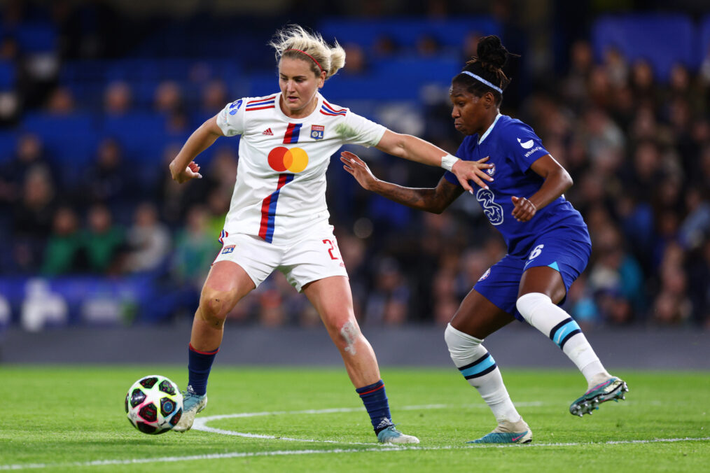 Lindsey Horan of Olympique Lyonnais and Kadeisha Buchanan of Chelsea battle for the ball during the UEFA Women's Champions League quarter-final 2nd leg match between Chelsea FC and Olympique Lyonnais at Stamford Bridge on March 30, 2023 in London, England
