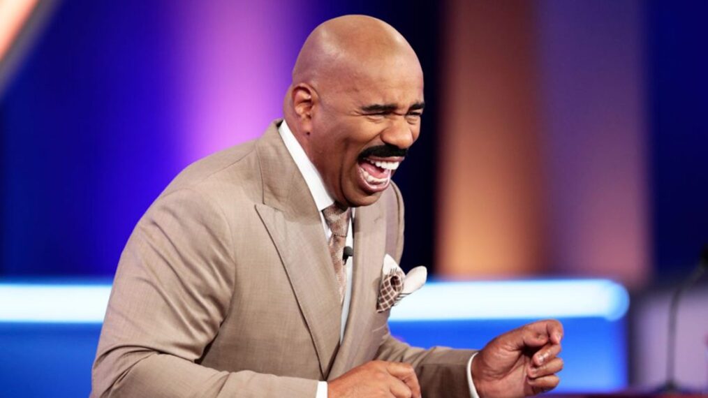 Steve Harvey laughing in an episode of 'Family Feud'