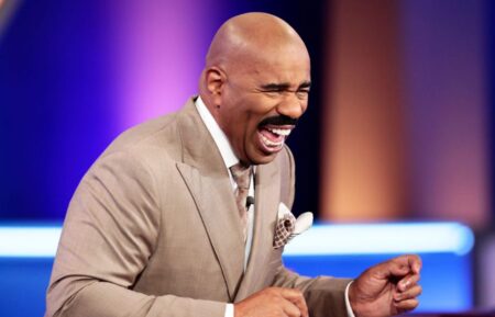 Steve Harvey laughing in an episode of 'Family Feud'