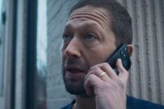 Ebon Moss-Bachrach on his cellphone in The Bear