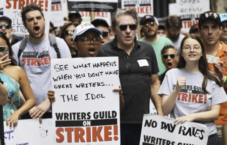 Members of the Writers Guild of America East picket at the Warner Bros. Discovery office in New York City on July 13, 2023