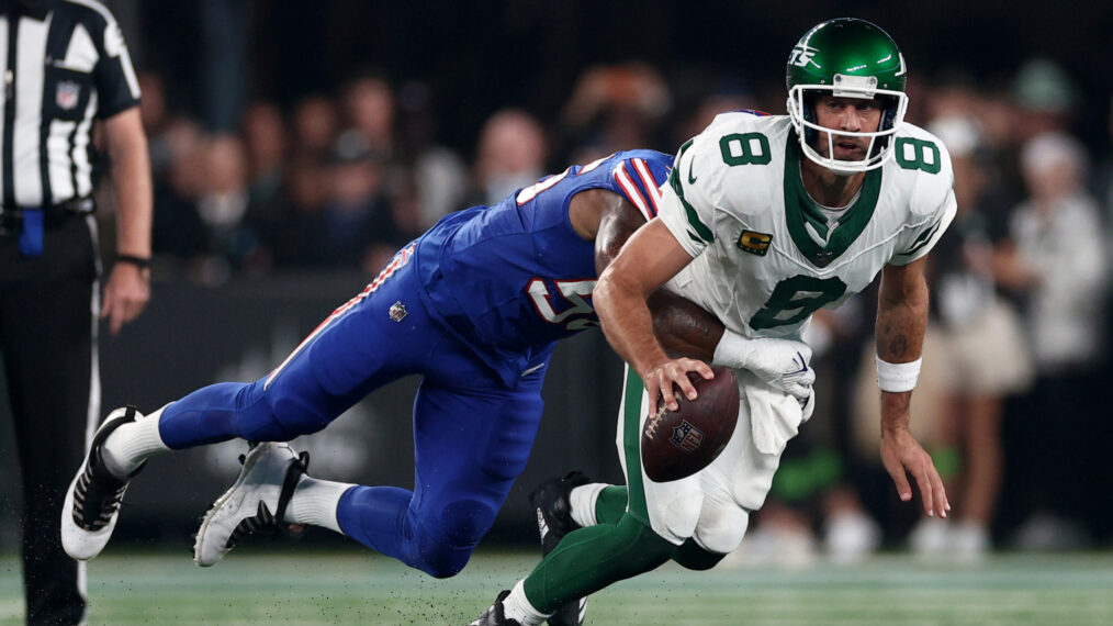 Quarterback Aaron Rodgers #8 of the New York Jets sacked by defensive end Leonard Floyd #56 of the Buffalo Bills during the first quarter of the NFL game at MetLife Stadium on September 11, 2023